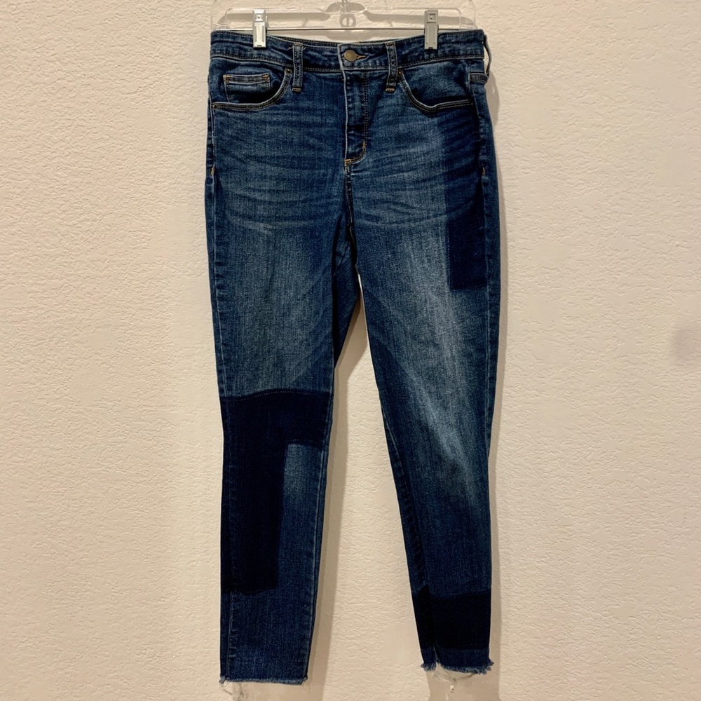 High rise ankle skinny jeans with patchwork pattern.